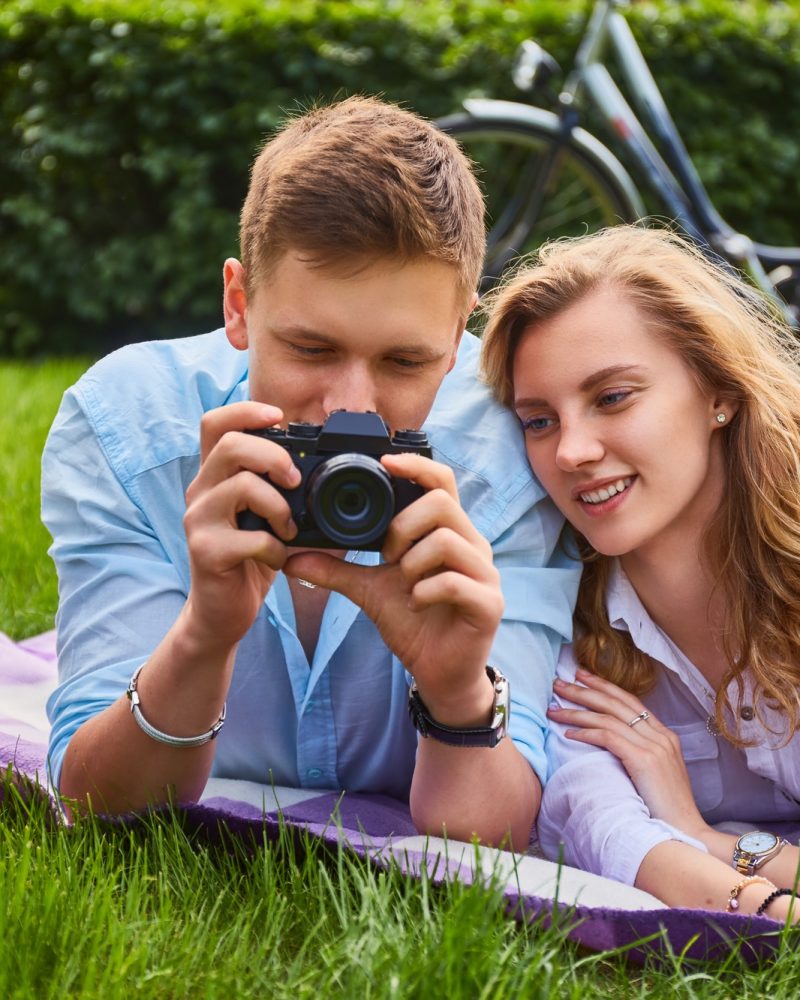 loving-young-couple-photo-shooting-and-relaxing-in-a-park-.jpg